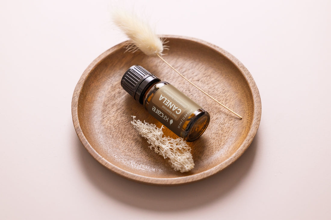 a small bottle of essential oils sitting on a plate