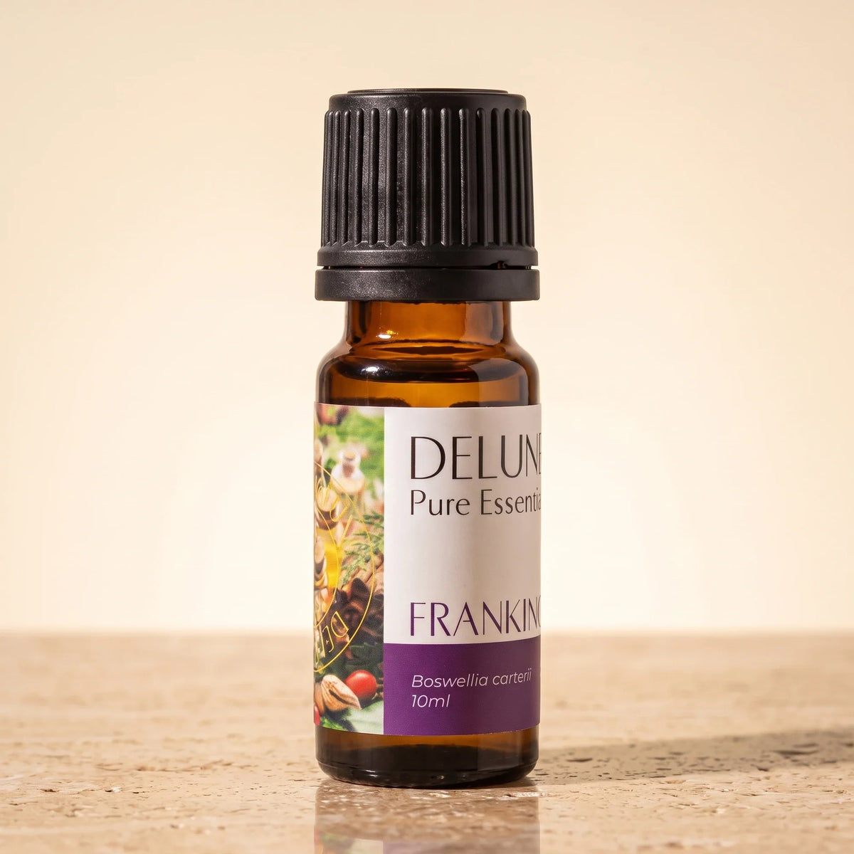Delune Frankincense (Boswellia Carterii) Pure Essential Oil, 10ml amber glass bottle on warm travertine stone