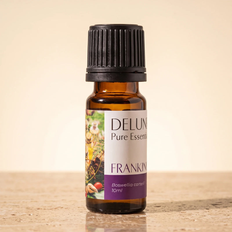 Delune Frankincense (Boswellia Carterii) Pure Essential Oil, 10ml amber glass bottle on warm travertine stone