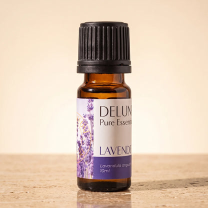Delune Lavender (French) Pure Essential Oil, 10ml amber glass bottle on warm travertine stone