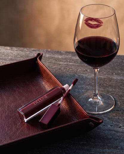Delune LuxMatte in Cabernet Kiss with a glass of cabernet