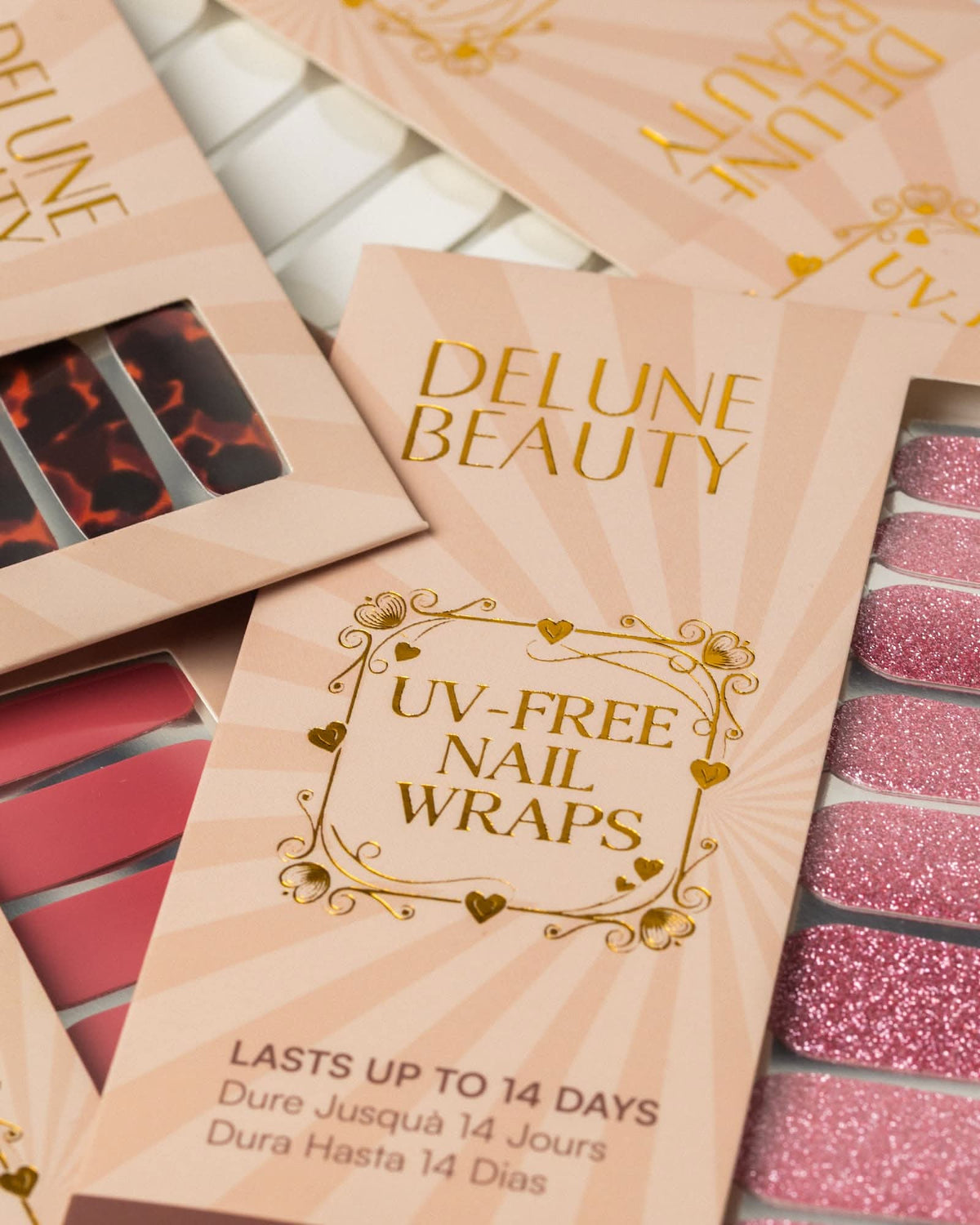 Tortoiseshell (Non-UV Nail Wraps): Delune Beauty UV-free nail wrap packaging, lasts up to 14 days, with tortoiseshell, red and pink glitter wraps