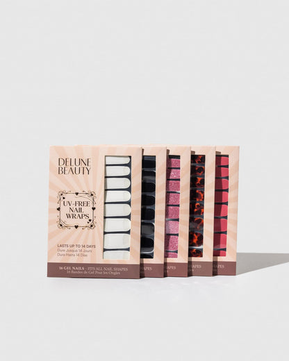 Glitter Bug (Non-UV Nail Wraps): row of Delune Beauty UV-free nail wrap packs standing upright