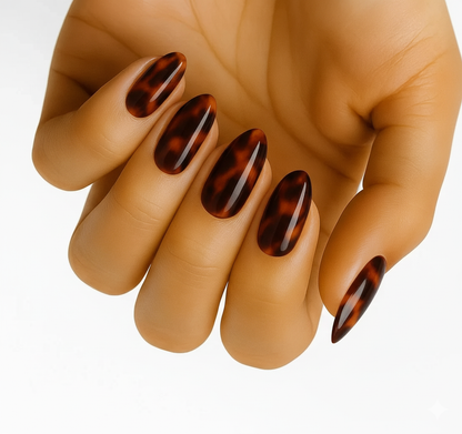 Tortoiseshell (Non-UV Nail Wraps): close-up of glossy amber, caramel and black tortoiseshell almond nails